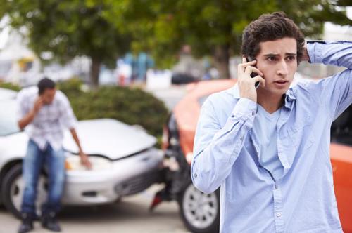 A man on the phone with an auto accident attorney in Atlanta.
