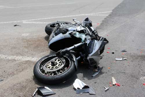 Motorcycle wreck in an abandoned parking lot. 