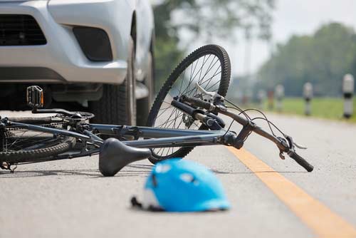 A bike accident involving a car in Macon, GA. 