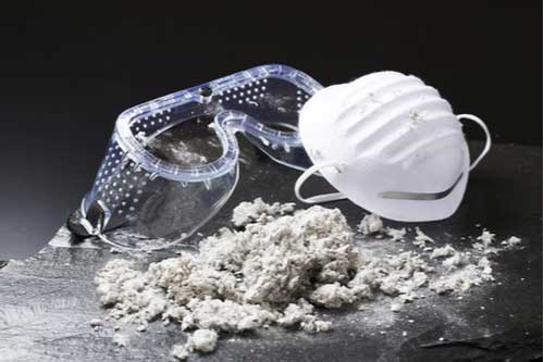 Goggles, face mask and asbestos, occupational diseases concept