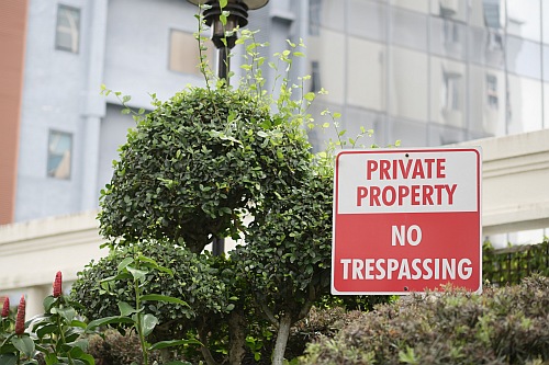suing for injury if you were trespassing is very difficult.