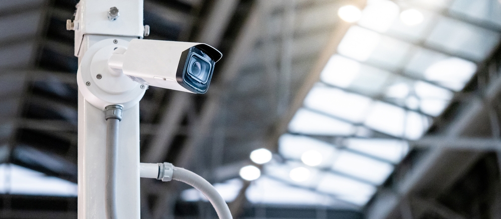Close-up of an indoor security camera, illustrating inadequate surveillance issues in Albany negligent security cases.