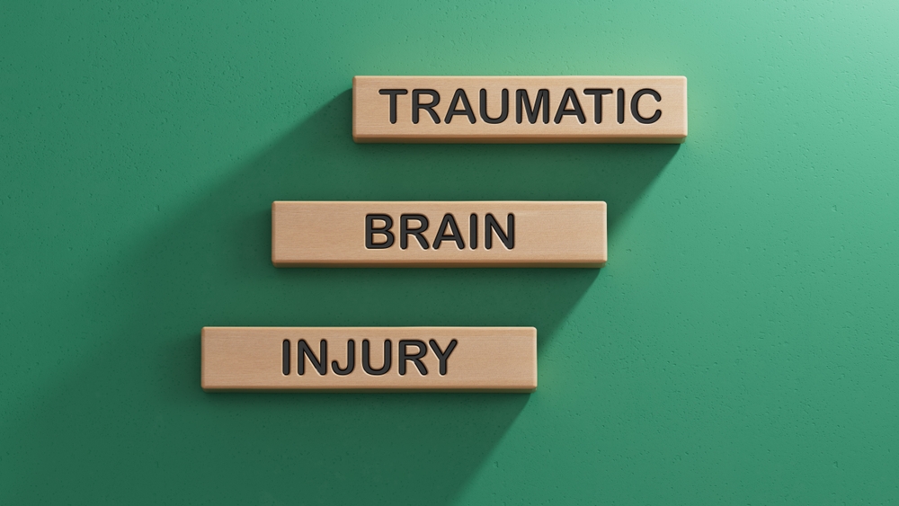 Albany Traumatic Brain Injury Lawyer 2 Blocks spelling traumatic brain injury arranged on a flat surface
