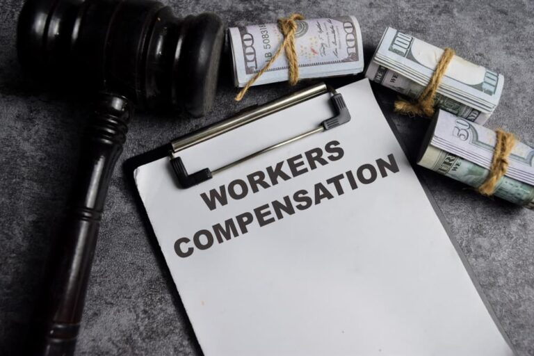 Concept of Workers compensation write on paperwork isolated on Wooden Table.
