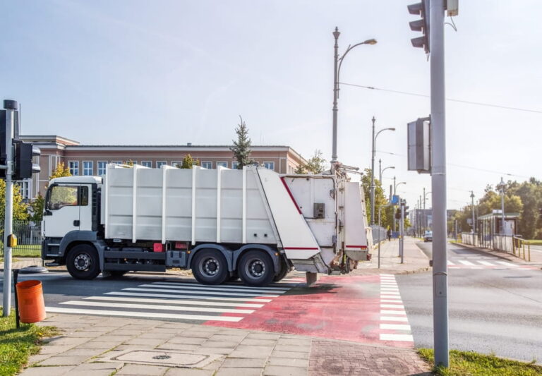 Garbage truck crossing intersection showing urban accident risk in Columbus GA